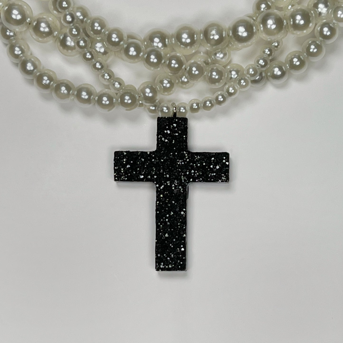 Braided pearl necklace with tiny-crystal cross pendant