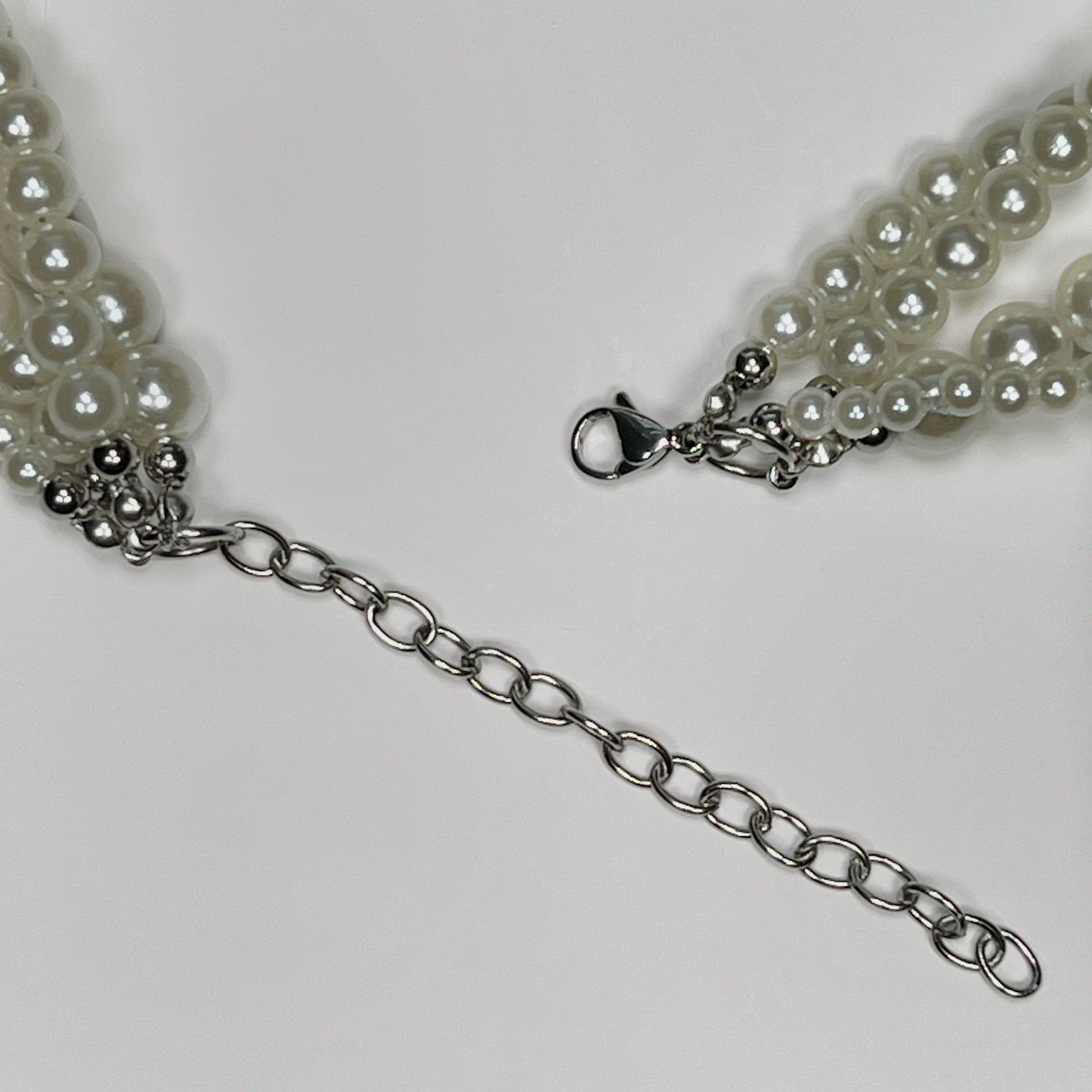 Braided pearl necklace with tiny-crystal cross pendant